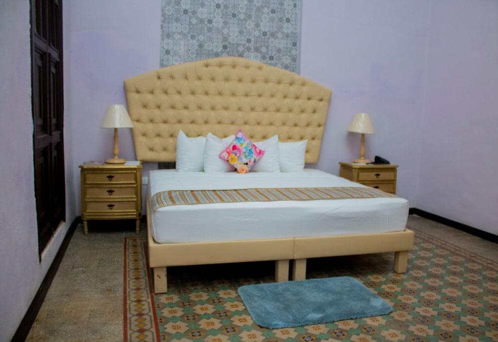Hotel Lavanda CAS Mérida Buitenkant foto A bedroom at the hotel