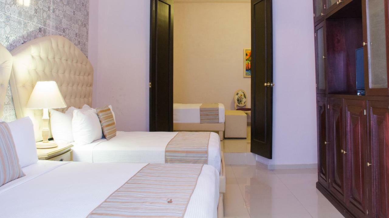 Hotel Lavanda CAS Mérida Buitenkant foto A bedroom at the hotel